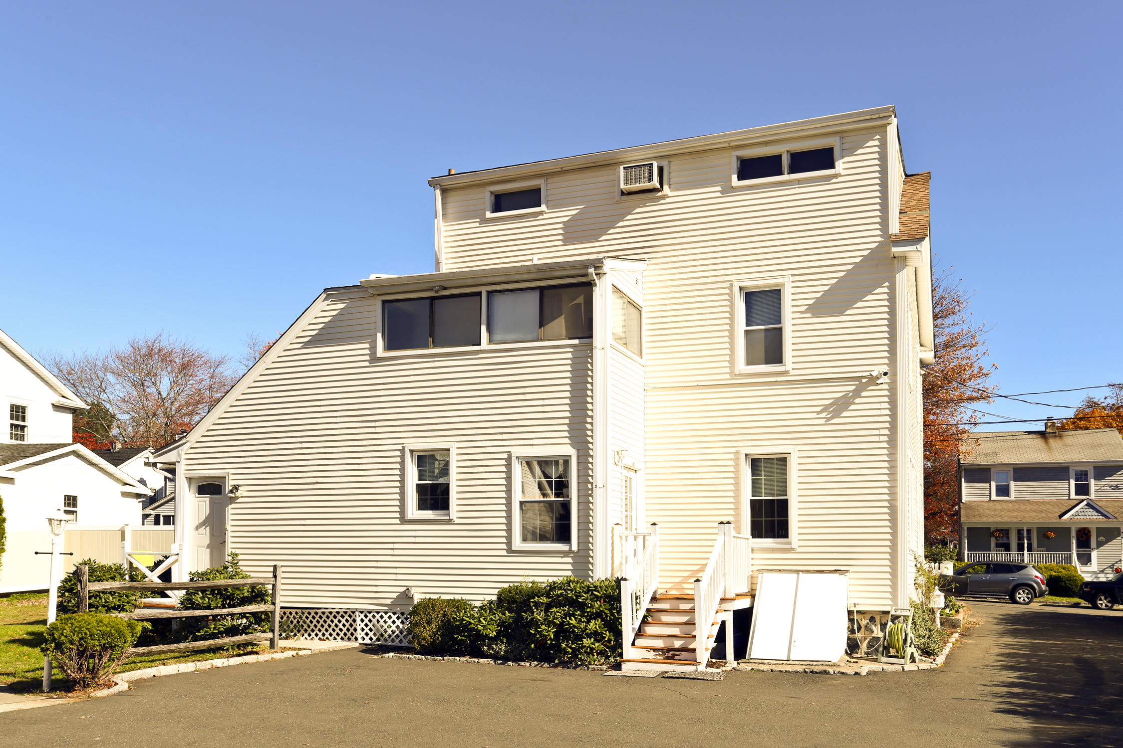 9 Joseph Street Darien, CT 06820 - Photo 8 of 18 a front view of a house with a road