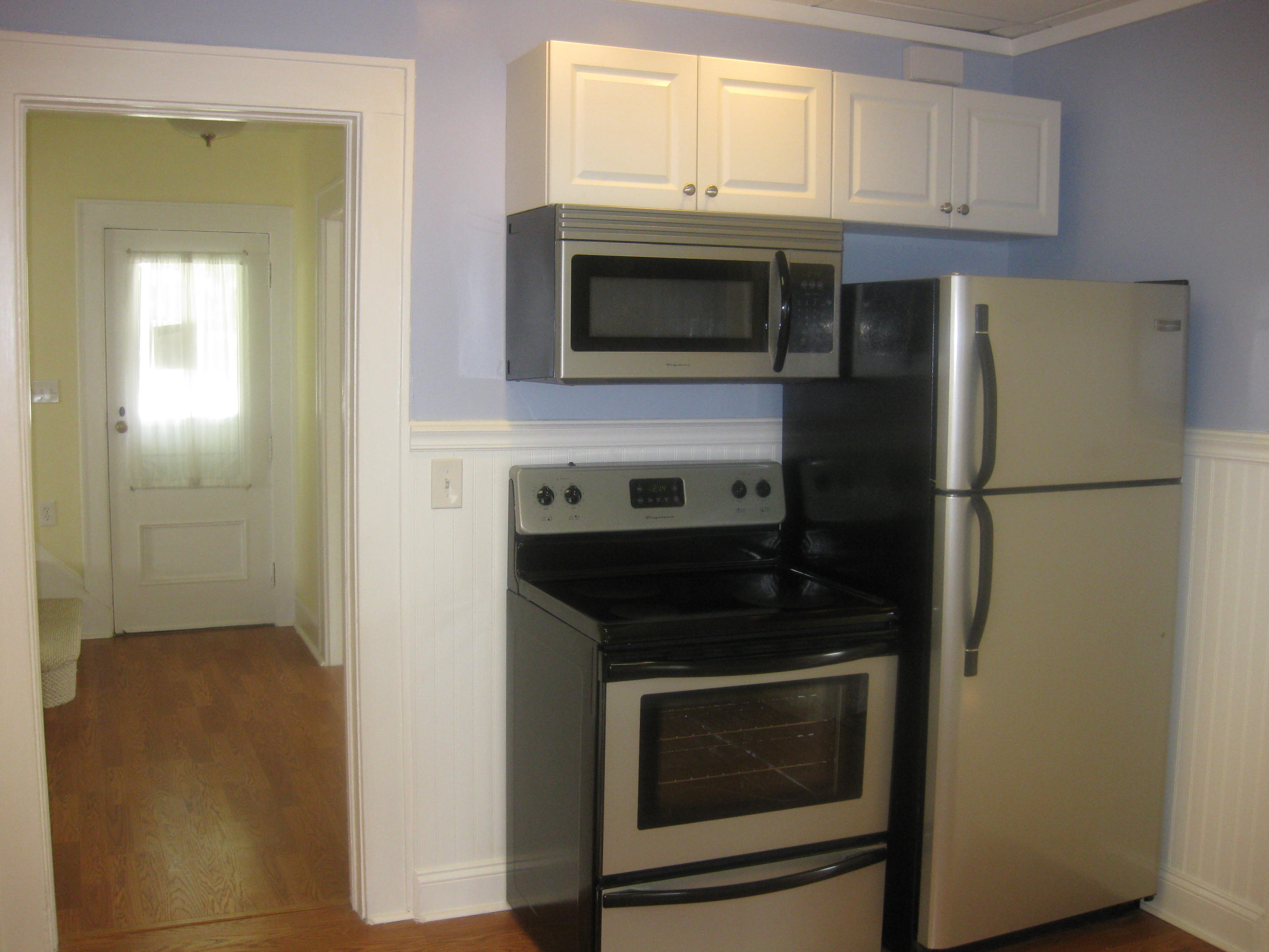 9 Joseph Street Darien, CT 06820 - Photo 10 of 18 a kitchen with stainless steel appliances a stove microwave and refrigerator