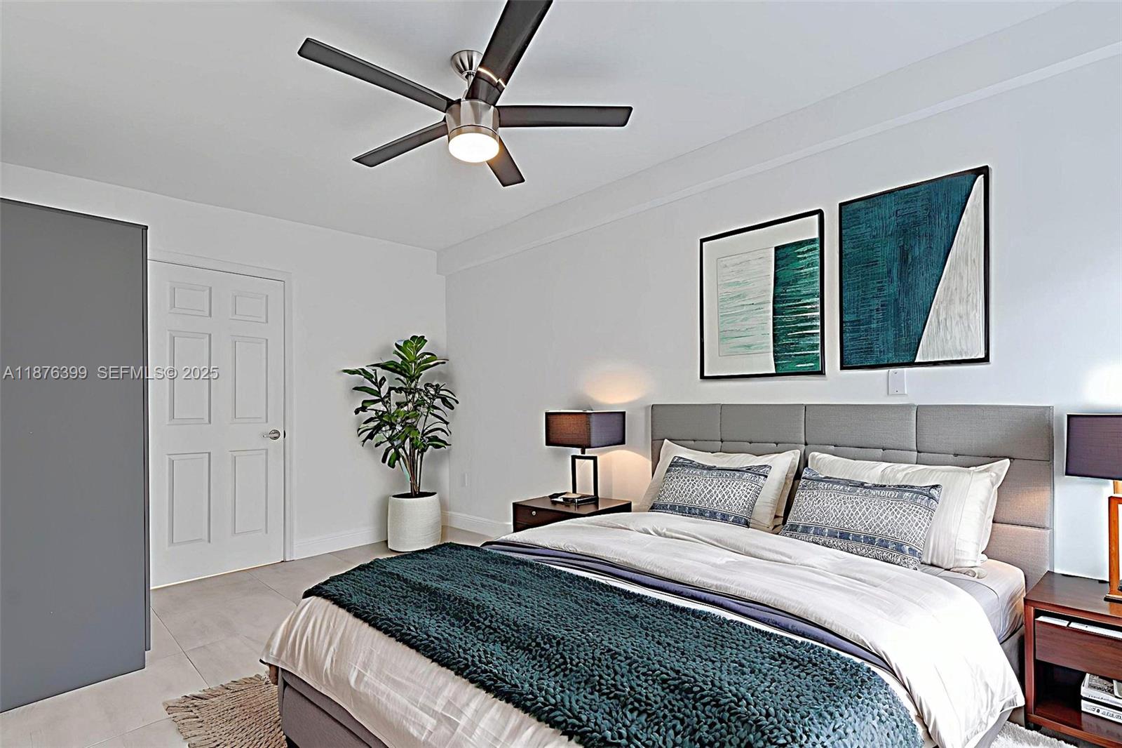 259 Northeast 56th Street, Unit 2 Miami, FL 33137 - Photo 12 of 23 a bedroom with a bed and a potted plant