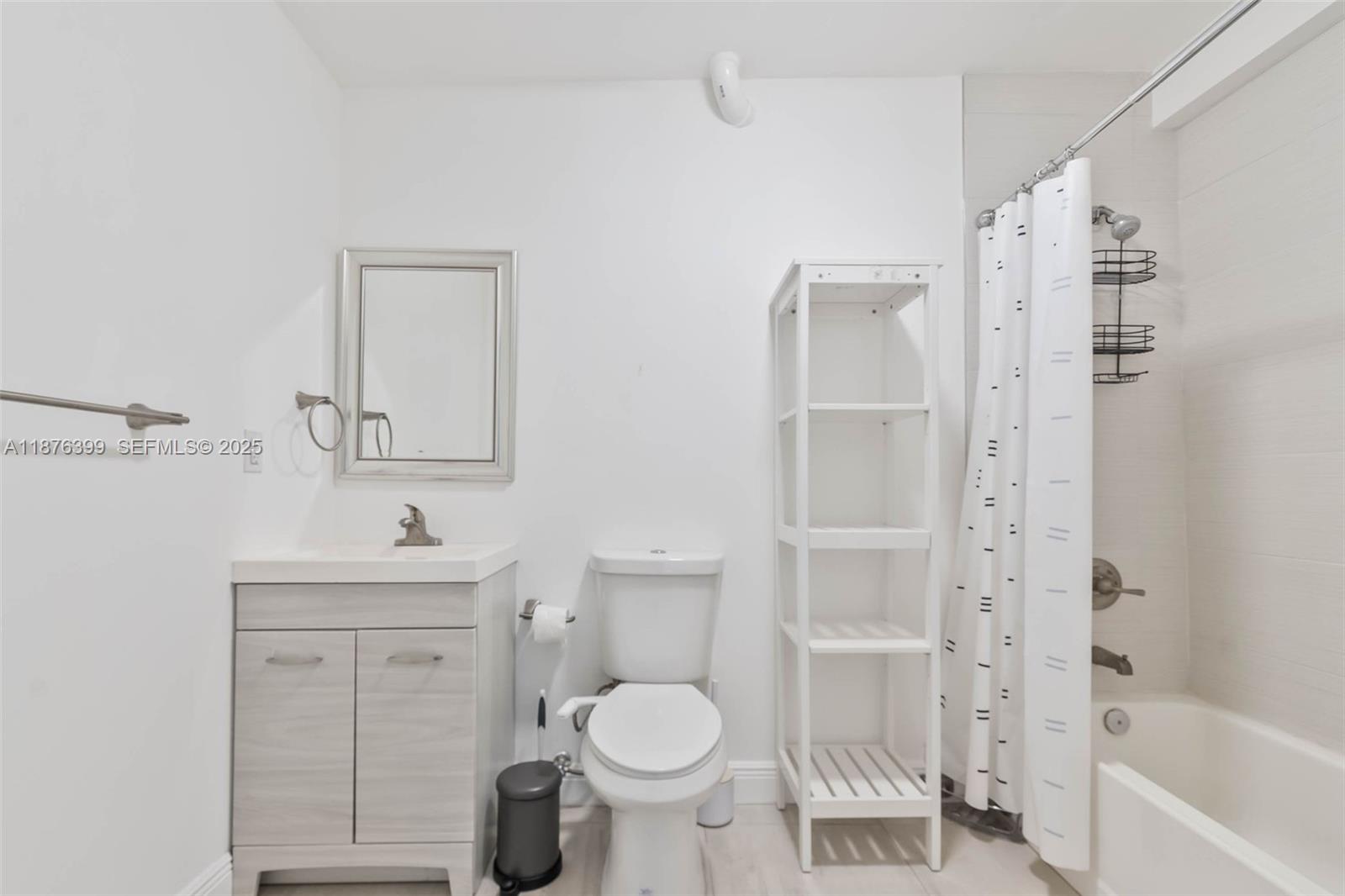 259 Northeast 56th Street, Unit 2 Miami, FL 33137 - Photo 13 of 23 a bathroom with a sink toilet and shower