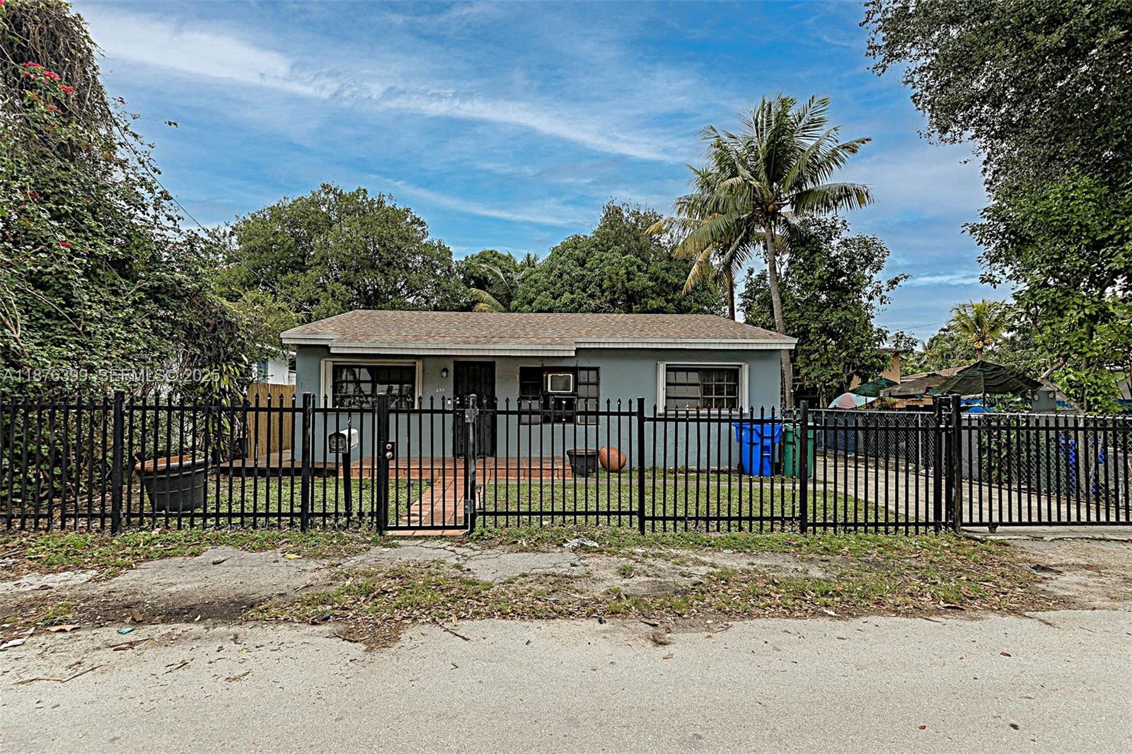 259 Northeast 56th Street, Unit 2 Miami, FL 33137 - Photo 14 of 23 a view of a house with a fence