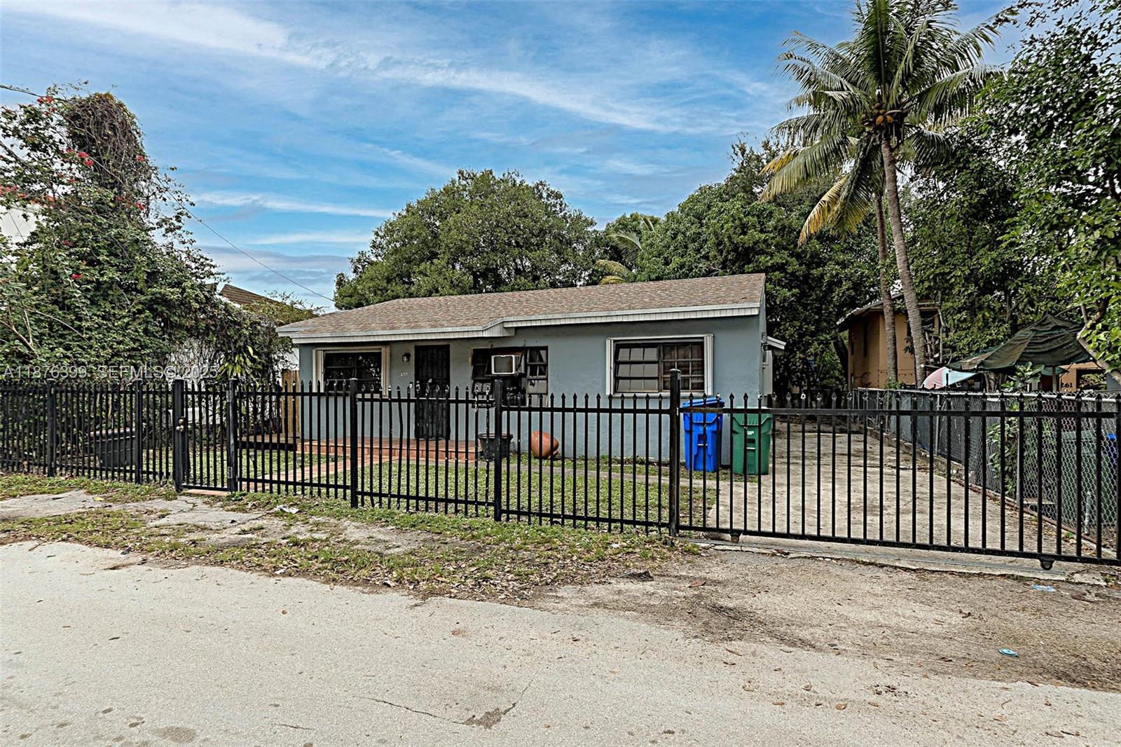 259 Northeast 56th Street, Unit 2 Miami, FL 33137 - Photo 15 of 23 a front view of a house with a garden