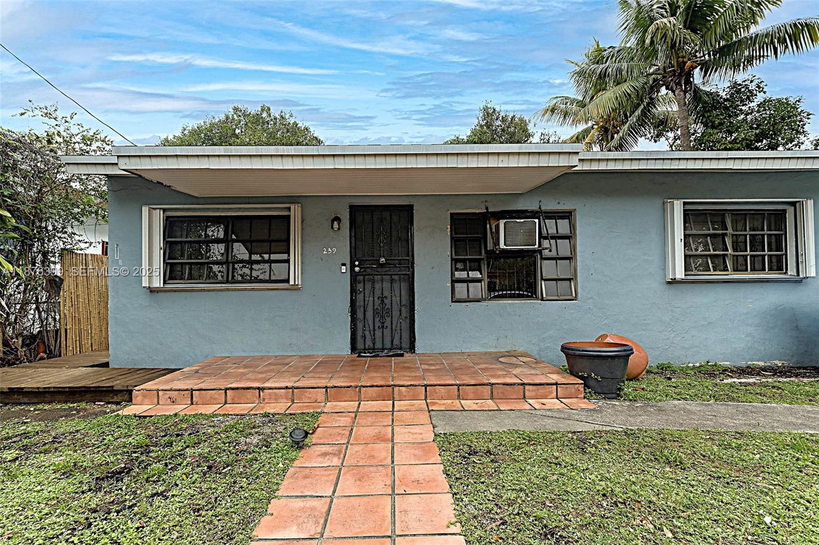 259 Northeast 56th Street, Unit 2 Miami, FL 33137 - Photo 16 of 23 a front view of a house with a yard