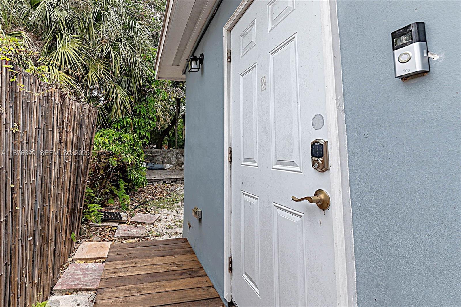 259 Northeast 56th Street, Unit 2 Miami, FL 33137 - Photo 3 of 23 a view of a door and wooden floor