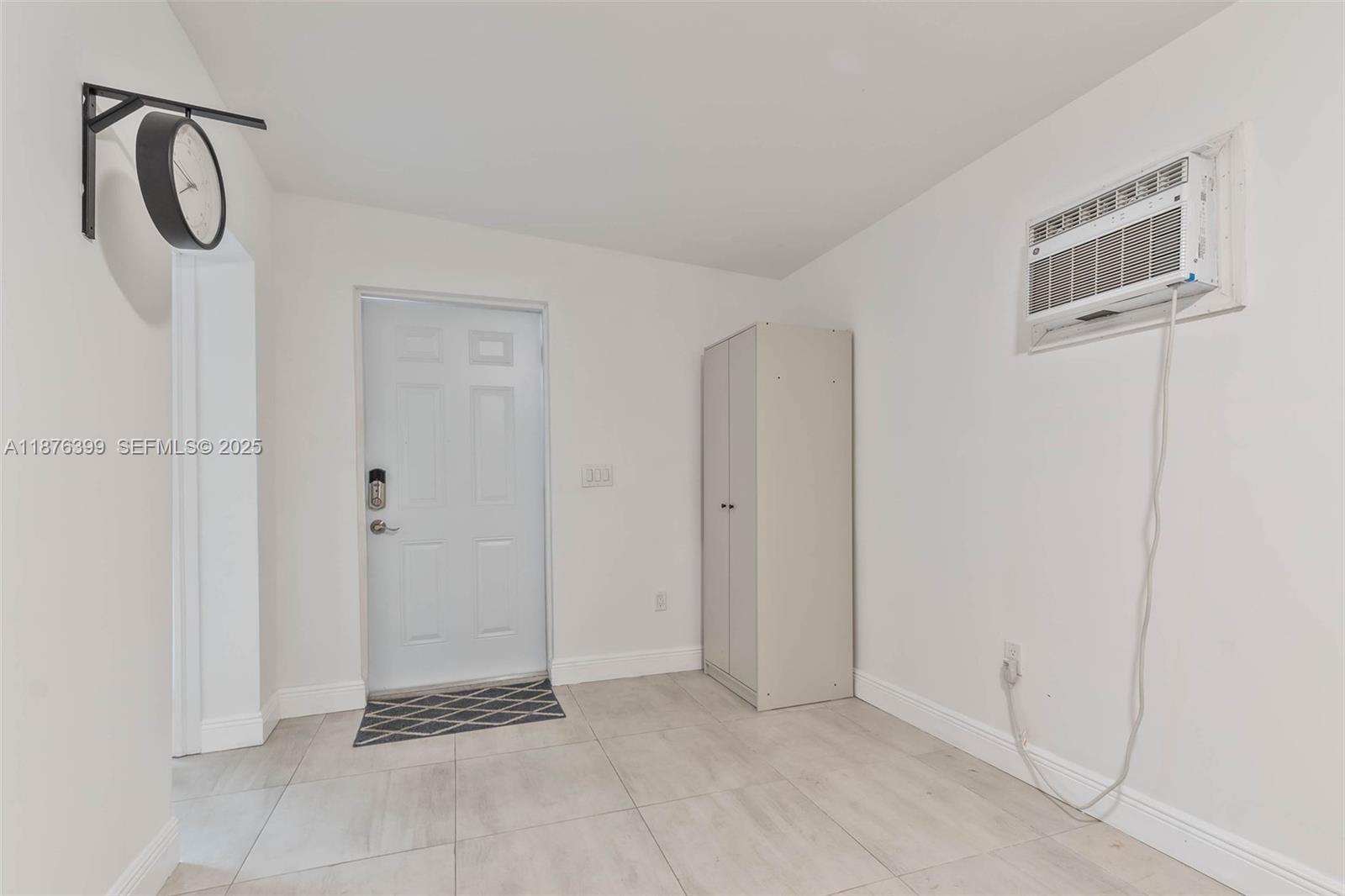 259 Northeast 56th Street, Unit 2 Miami, FL 33137 - Photo 4 of 23 a view of a hallway with painted walls