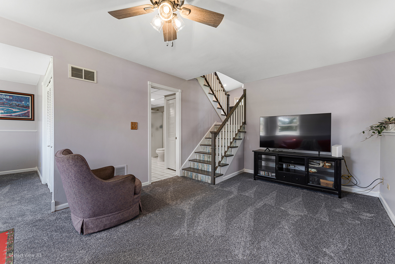 100 White Oak Drive Lindenhurst, IL 60046 - Photo 14 of 22 a living room with furniture and a flat screen tv