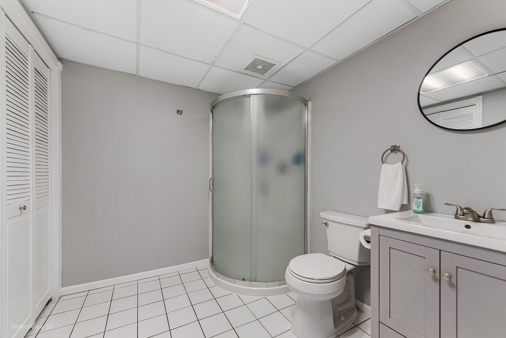 100 White Oak Drive Lindenhurst, IL 60046 - Photo 17 of 22 a bathroom with a toilet sink vanity and mirror