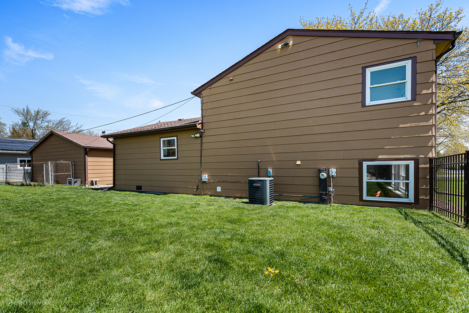 100 White Oak Drive Lindenhurst, IL 60046 - Photo 22 of 22 a front view of a house with a yard