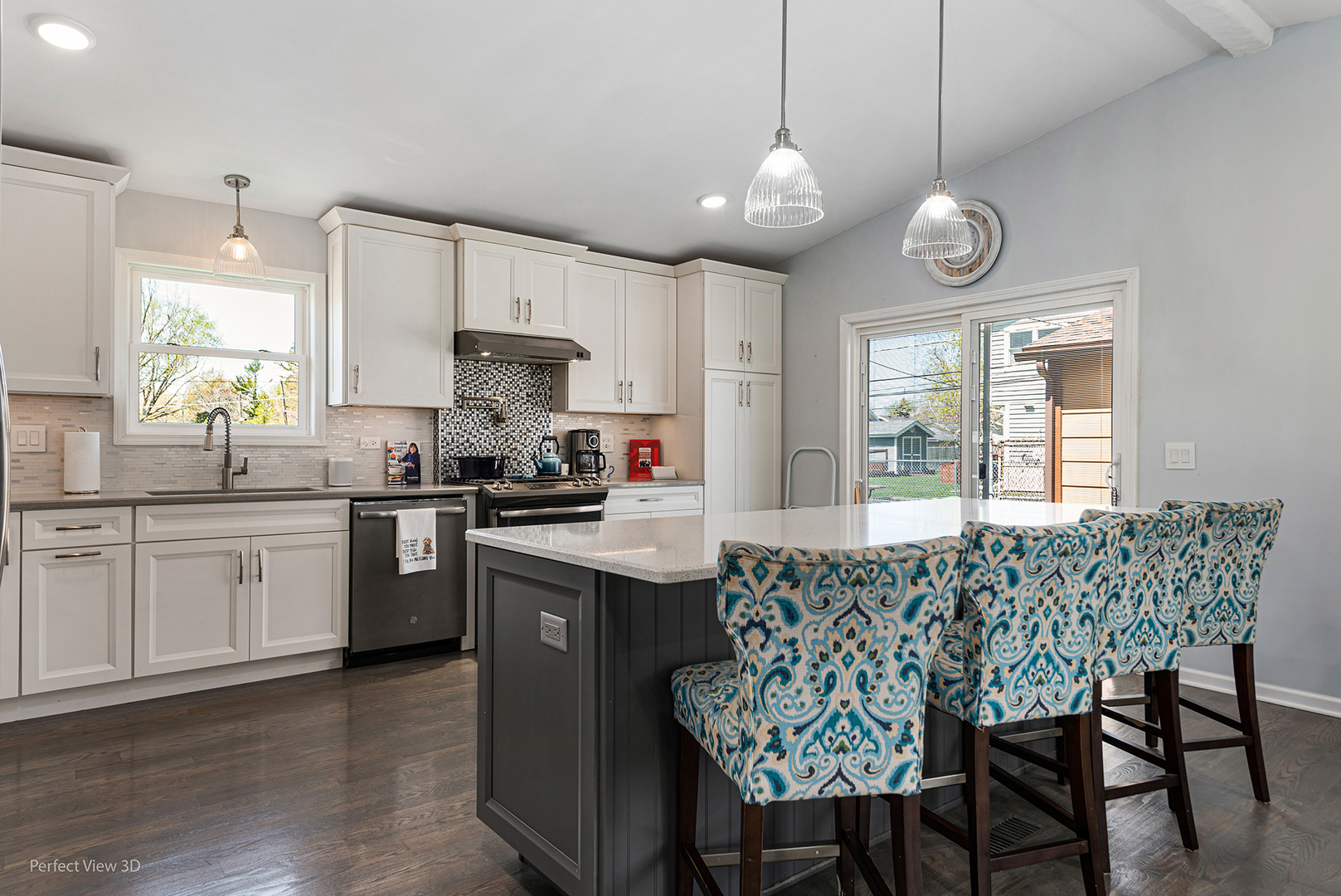 100 White Oak Drive Lindenhurst, IL 60046 - Photo 3 of 22 a kitchen with stainless steel appliances granite countertop a stove a sink dishwasher a dining table and chairs with wooden floor