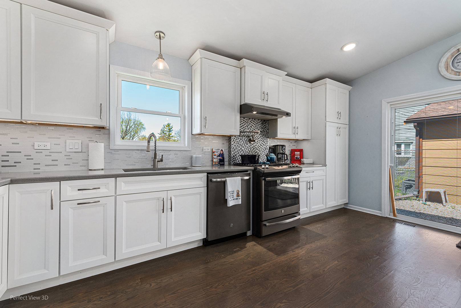 100 White Oak Drive Lindenhurst, IL 60046 - Photo 4 of 22 a kitchen with stainless steel appliances granite countertop a refrigerator sink and white cabinets