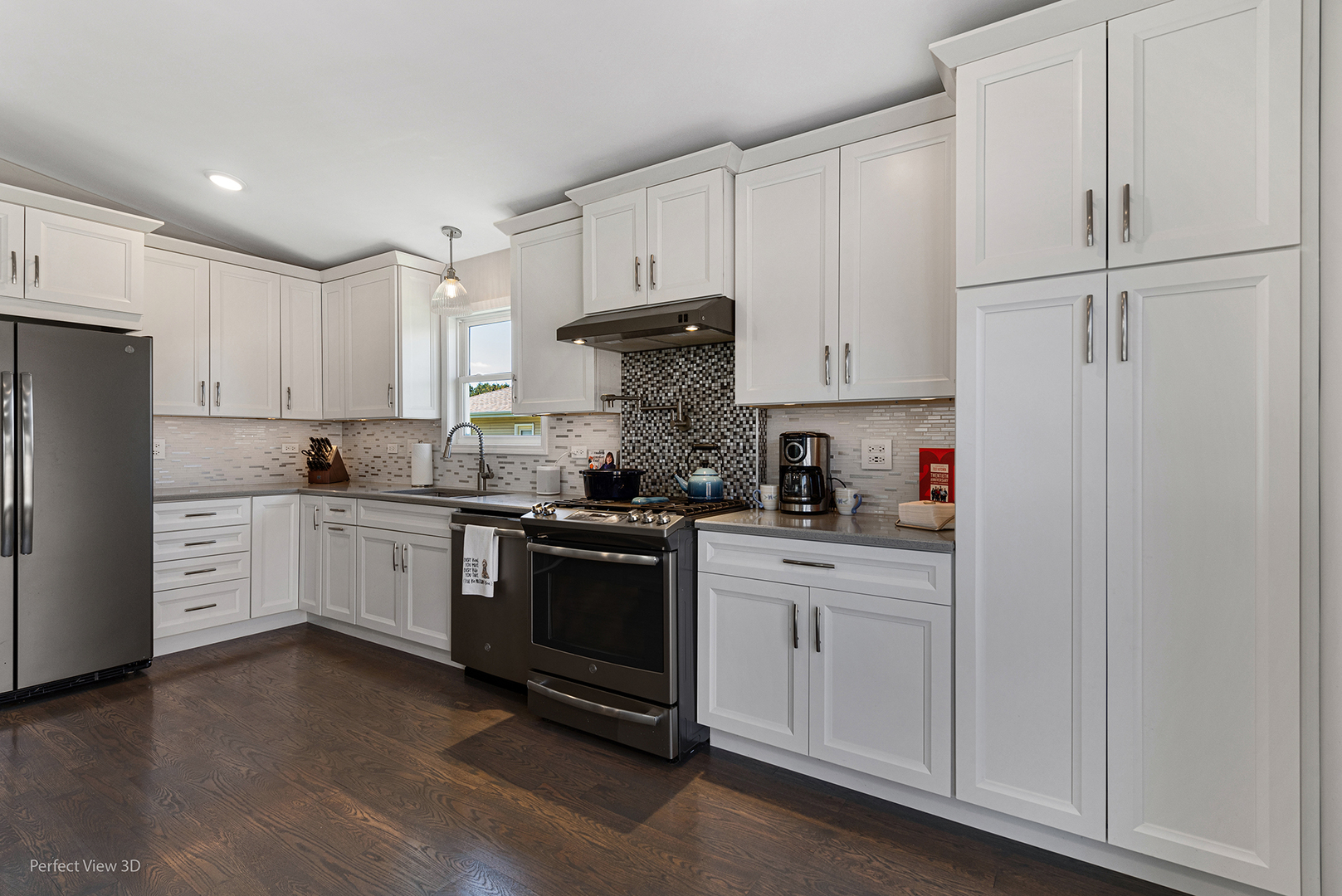 100 White Oak Drive Lindenhurst, IL 60046 - Photo 5 of 22 a kitchen with granite countertop white cabinets and stainless steel appliances