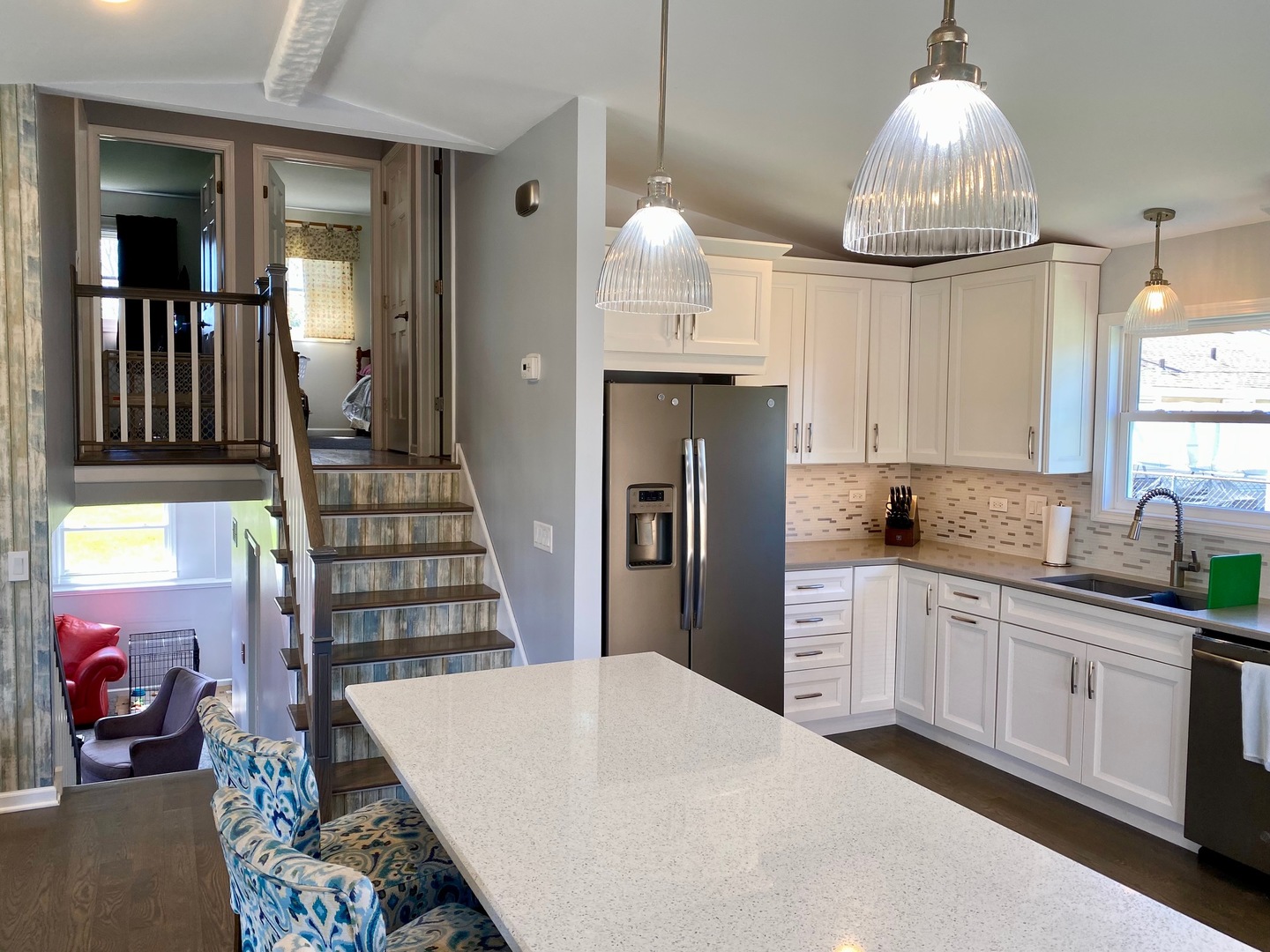 100 White Oak Drive Lindenhurst, IL 60046 - Photo 7 of 22 a kitchen with cabinets and a chandelier
