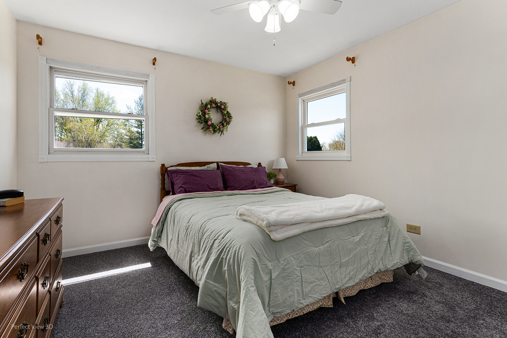 100 White Oak Drive Lindenhurst, IL 60046 - Photo 10 of 22 a bedroom with a bed and a window