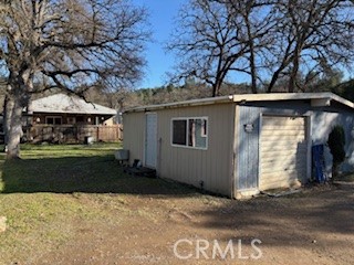 3392 Grey Clearlake, CA 95422 - Photo 3 of 11 a front view of a house with a yard