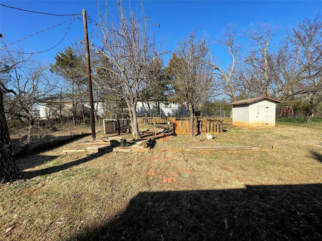 117 East Prospect Street Denison, TX 75021 - Photo 12 of 13 a view of a yard with snow on the road
