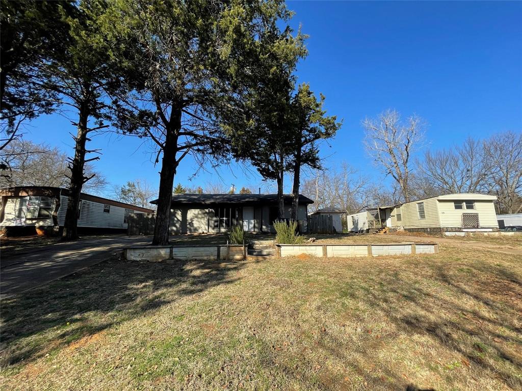 117 East Prospect Street Denison, TX 75021 - Photo 5 of 13 a house view with a outdoor space