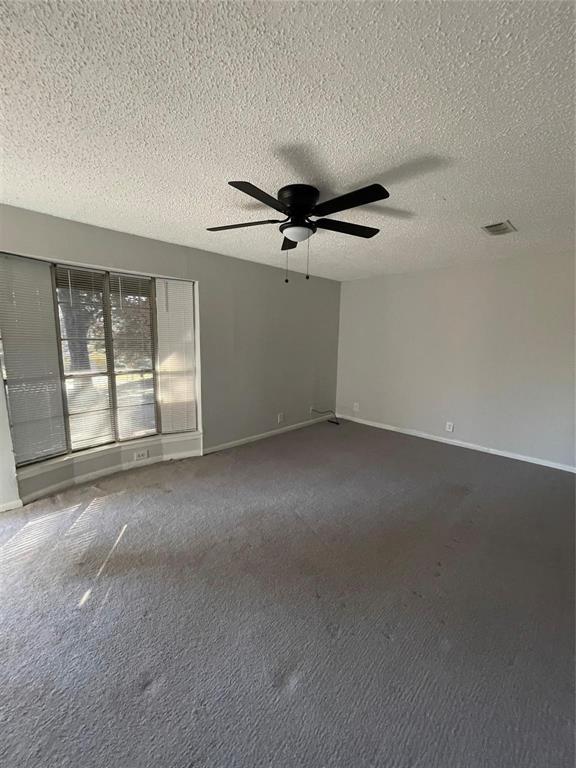 117 East Prospect Street Denison, TX 75021 - Photo 7 of 13 a view of an empty room with a window