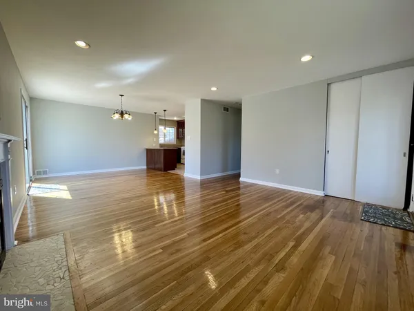 a view of a livingroom with wooden floor