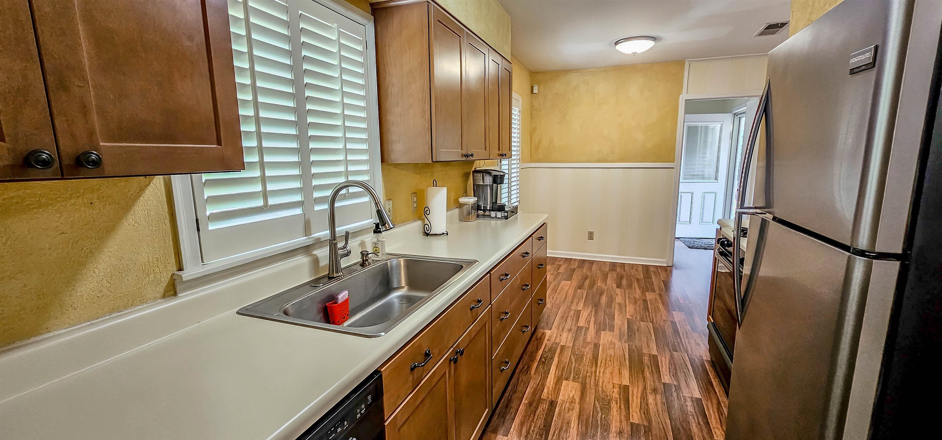 5246 Quince Road Memphis, TN 38117 - Photo 12 of 28 a view of a kitchen with a sink and dishwasher