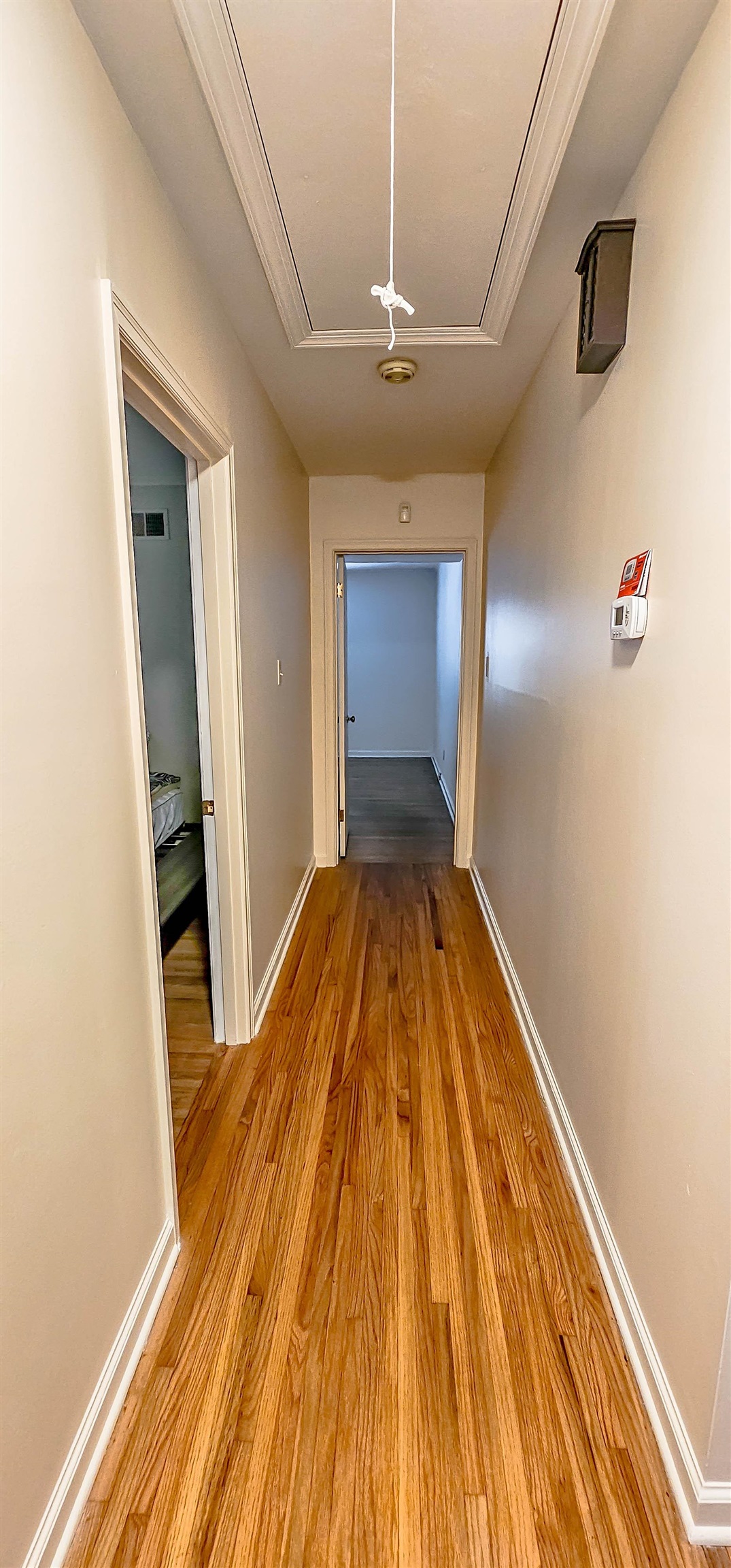 5246 Quince Road Memphis, TN 38117 - Photo 13 of 28 a bedroom with a bed and wooden floor