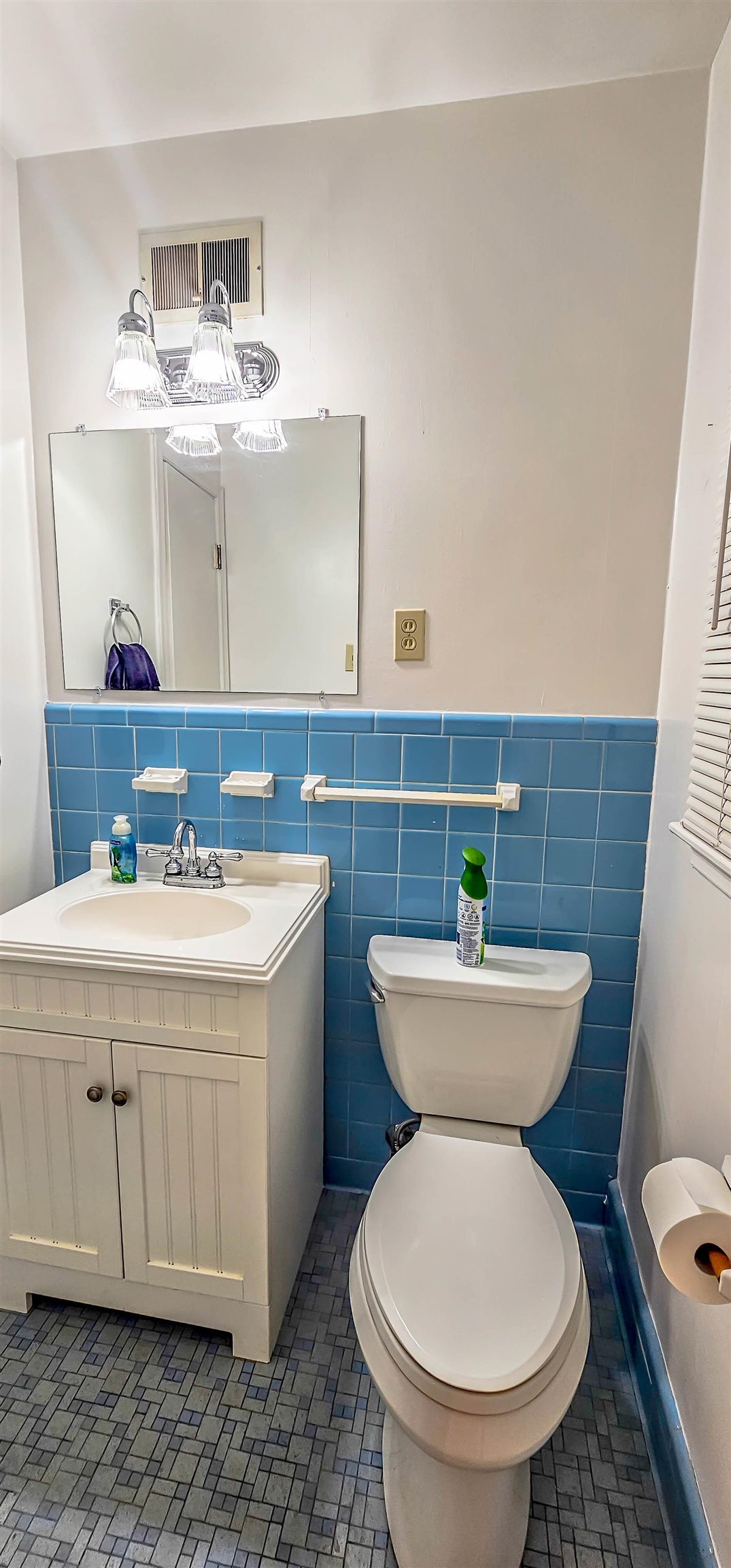 5246 Quince Road Memphis, TN 38117 - Photo 17 of 28 a bathroom with a sink a toilet and mirror
