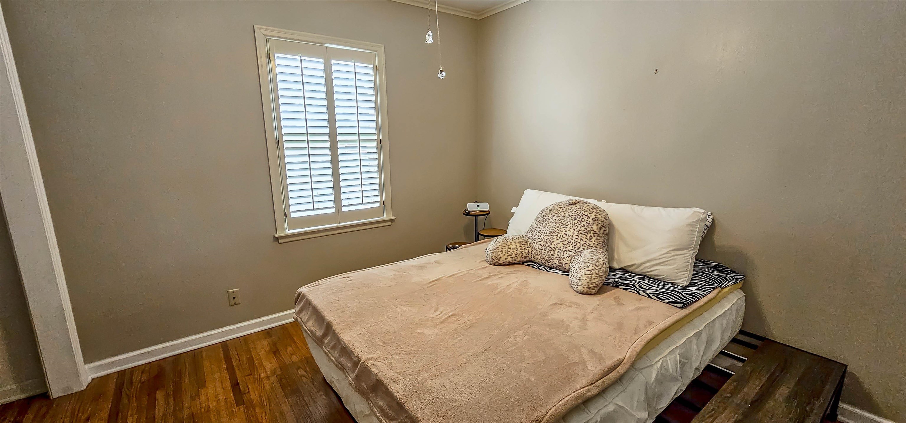 5246 Quince Road Memphis, TN 38117 - Photo 18 of 28 a bedroom with a bed and window