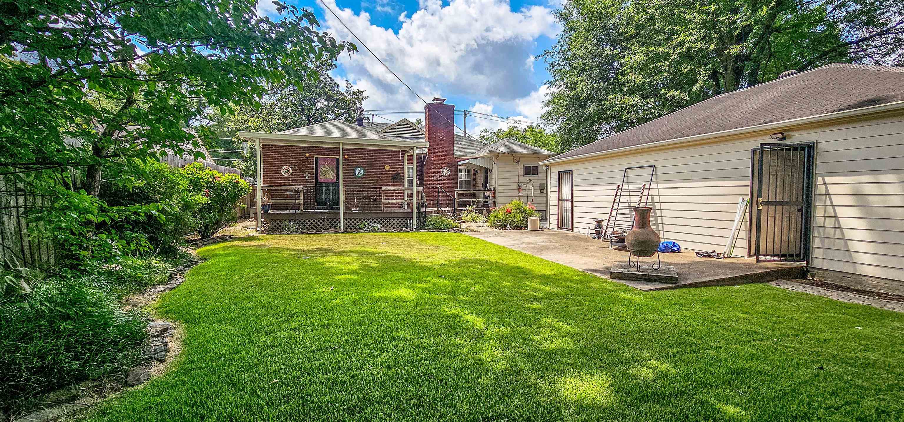 5246 Quince Road Memphis, TN 38117 - Photo 28 of 28 a view of a house with a yard and sitting area