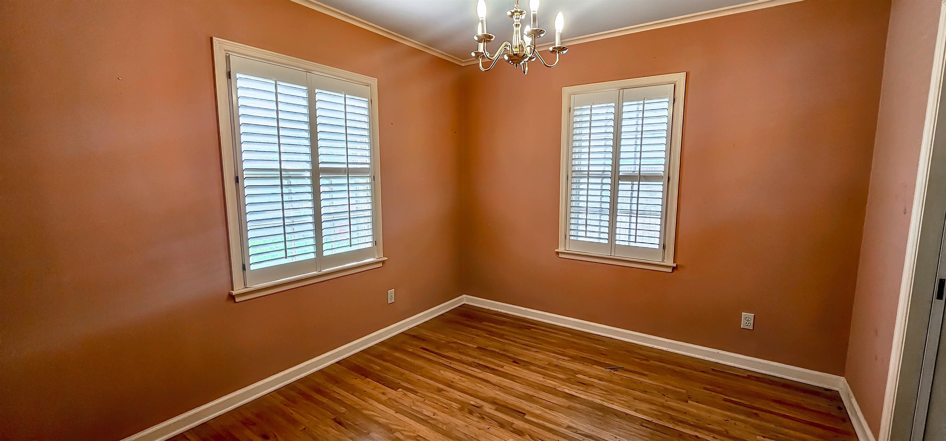 5246 Quince Road Memphis, TN 38117 - Photo 7 of 28 a view of empty room with wooden floor and fan