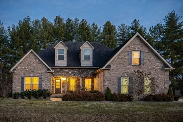 a front view of a house with a yard