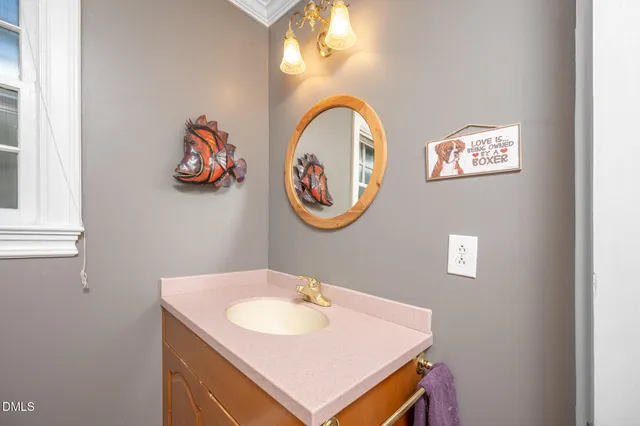a view of a hallway with wooden floor and stairs