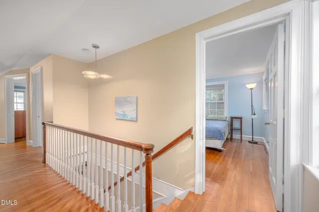 a view of sitting area with trees in a backyard