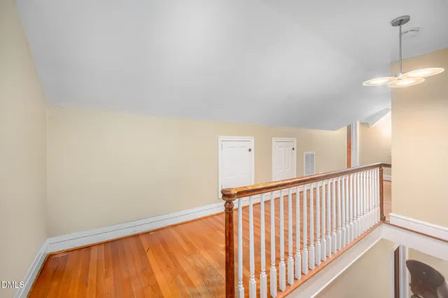 a view of a roof deck with wooden floor and fence