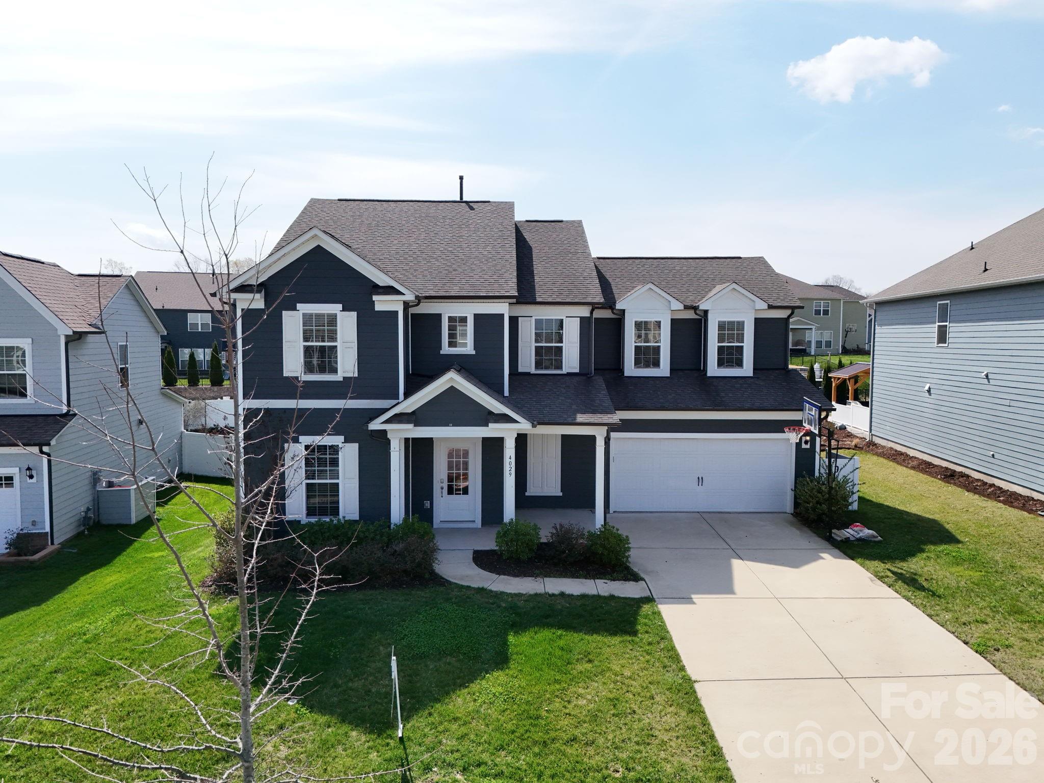 4029 Spring Garden Street Fort Mill, SC 29715 - Photo 14 of 48 a front view of a house with a yard