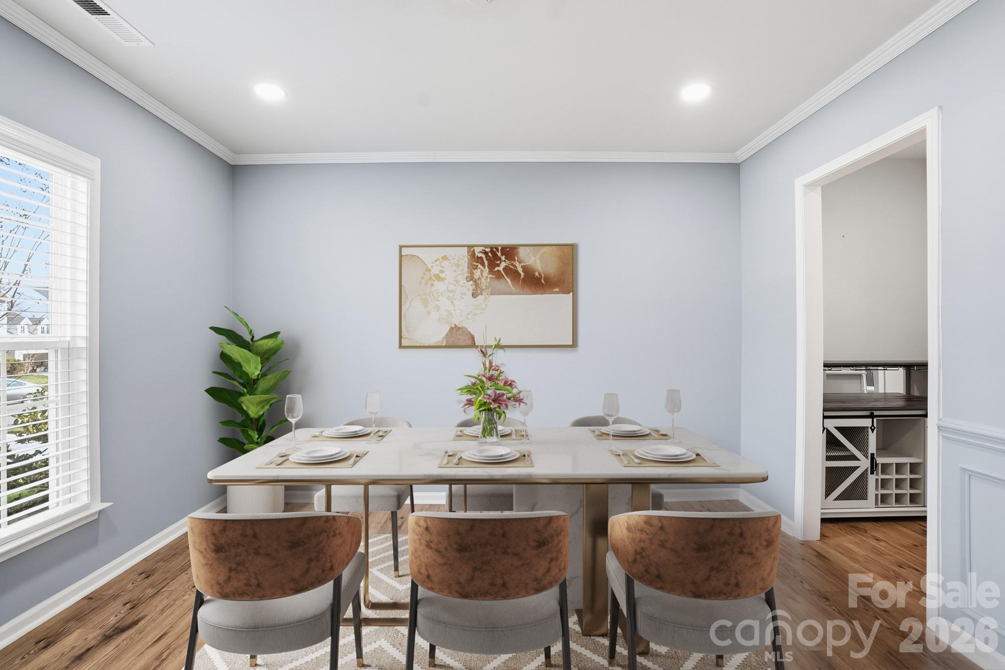 4029 Spring Garden Street Fort Mill, SC 29715 - Photo 2 of 48 a view of a dining room with furniture and wooden floor