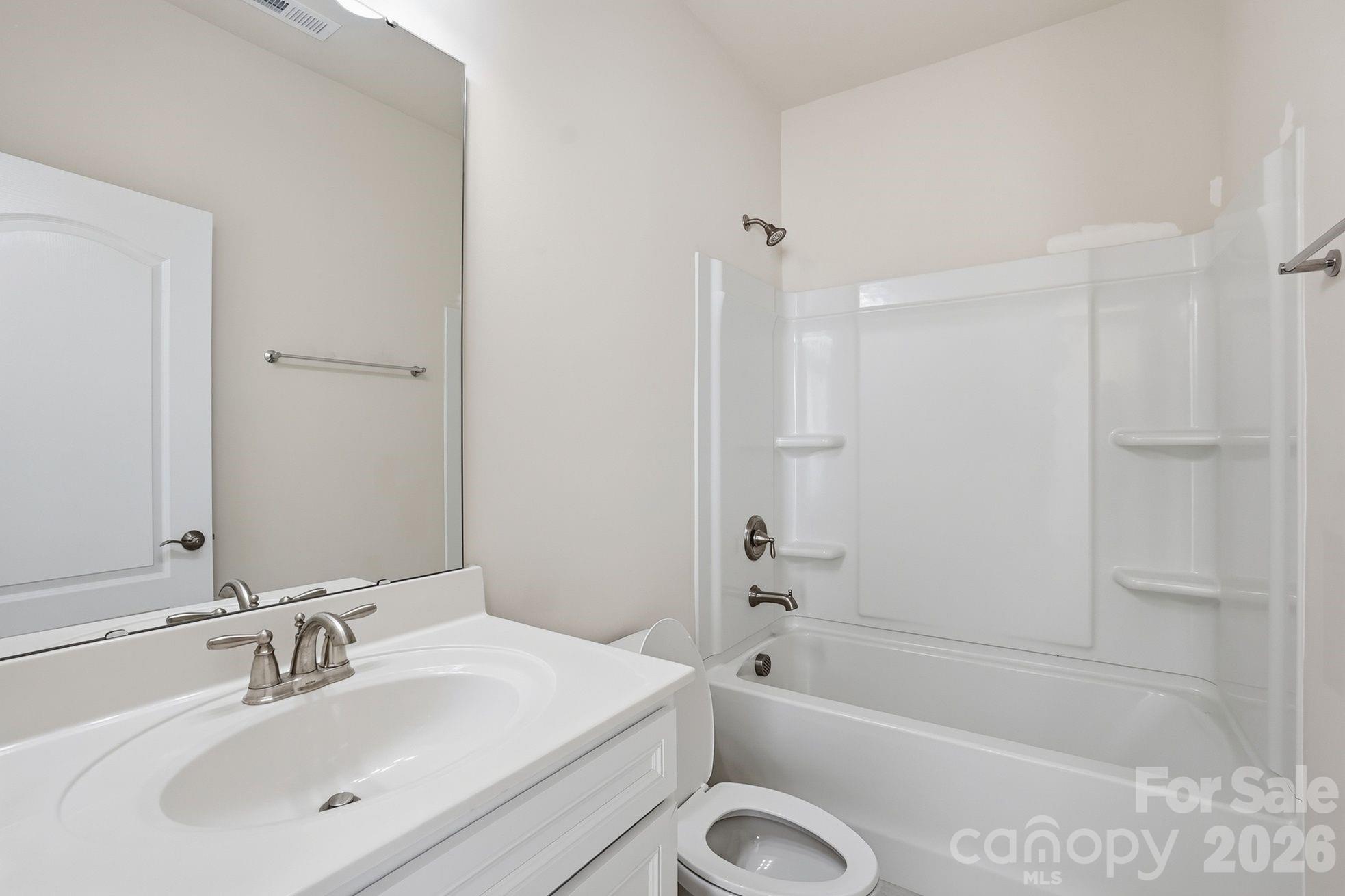 4029 Spring Garden Street Fort Mill, SC 29715 - Photo 23 of 48 a bathroom with a tub shower sink vanity and a toilet