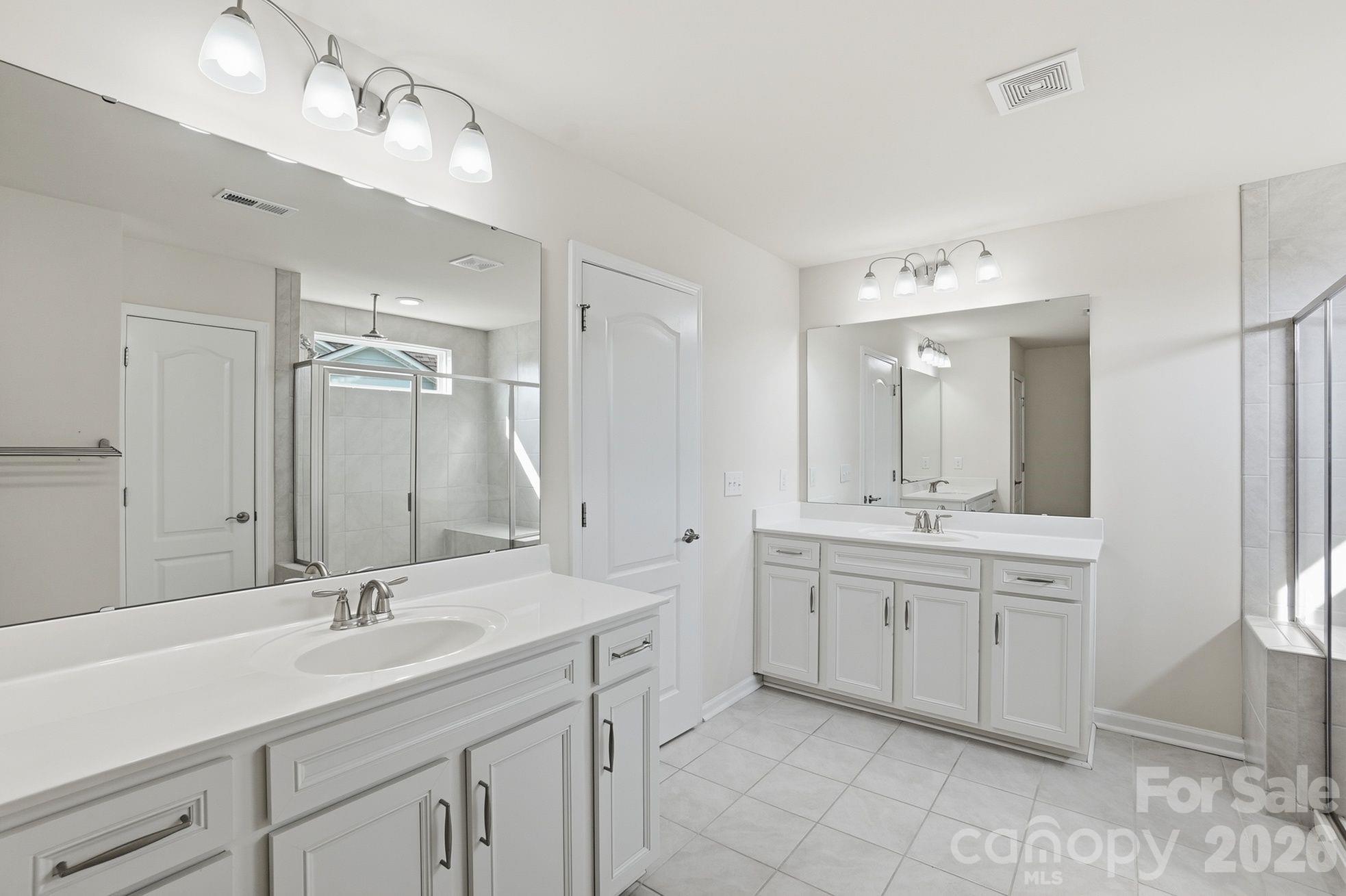 4029 Spring Garden Street Fort Mill, SC 29715 - Photo 25 of 48 a bathroom with a granite countertop sink double and mirror