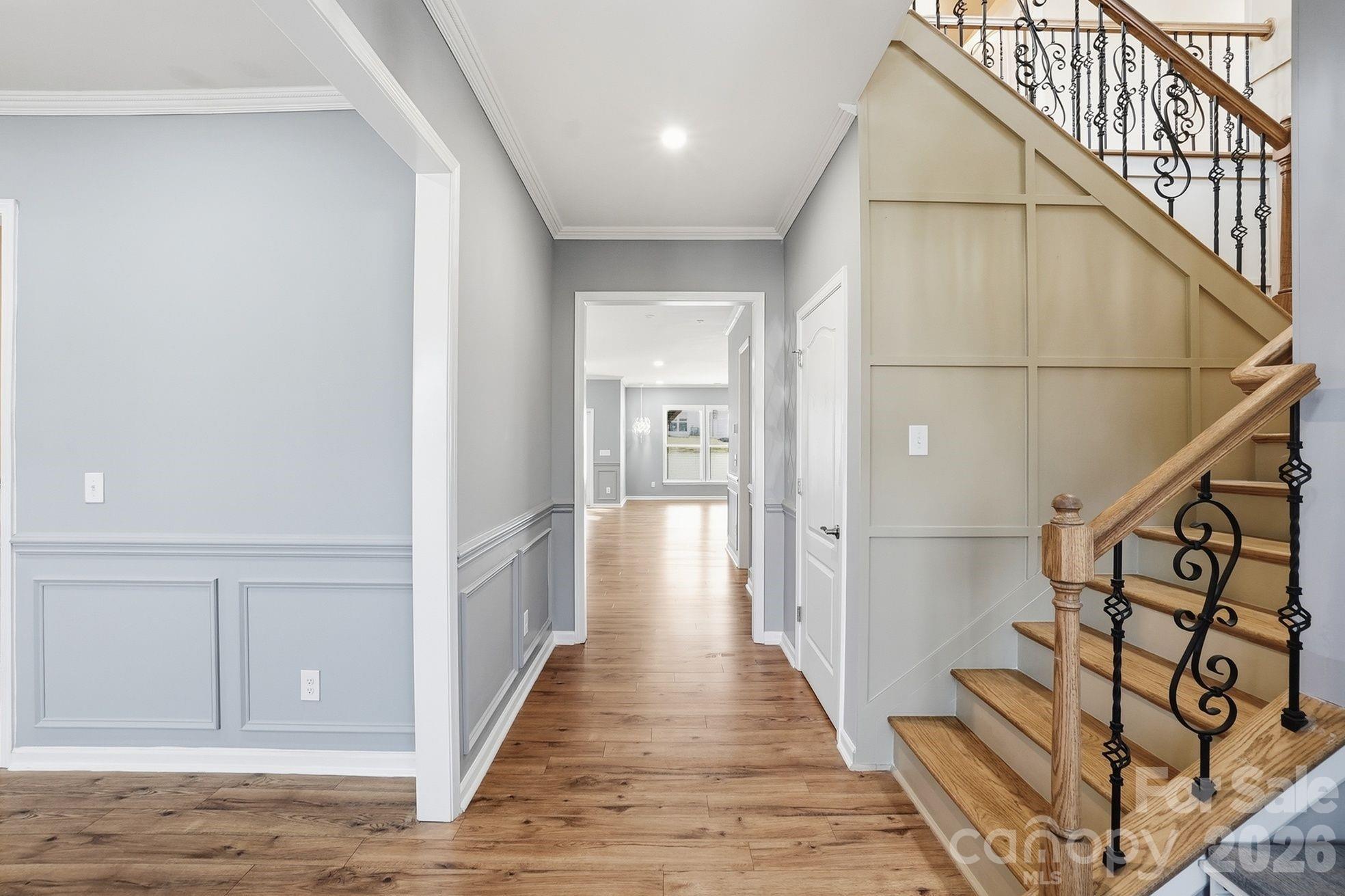 4029 Spring Garden Street Fort Mill, SC 29715 - Photo 26 of 48 a view of a hallway with wooden floor and staircase