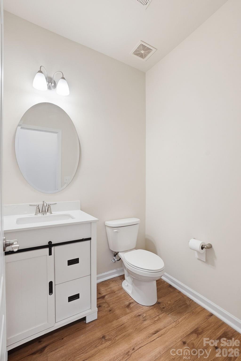 4029 Spring Garden Street Fort Mill, SC 29715 - Photo 30 of 48 a bathroom with a toilet a sink and mirror