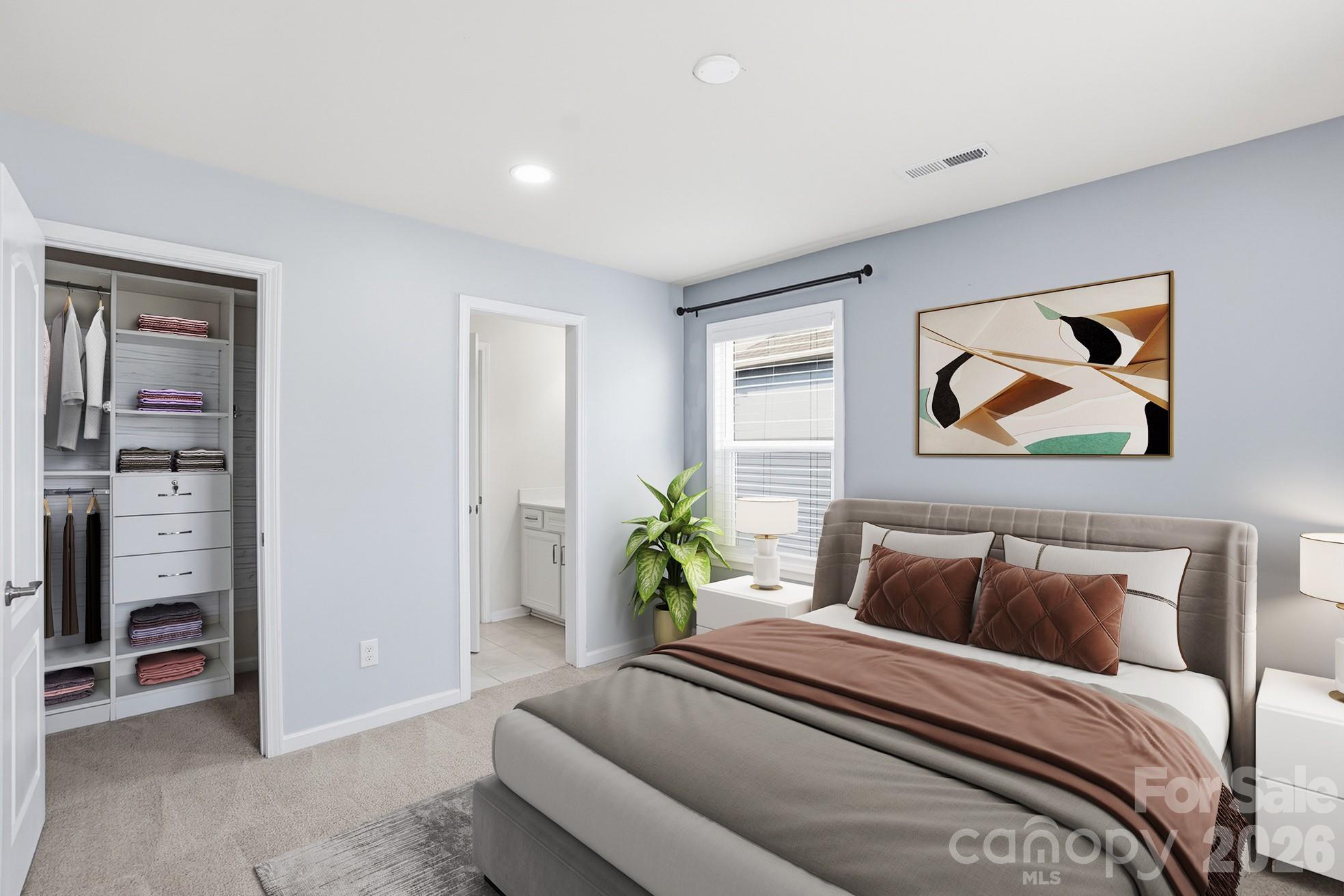 4029 Spring Garden Street Fort Mill, SC 29715 - Photo 3 of 48 a bedroom with a bed and a painting on the wall