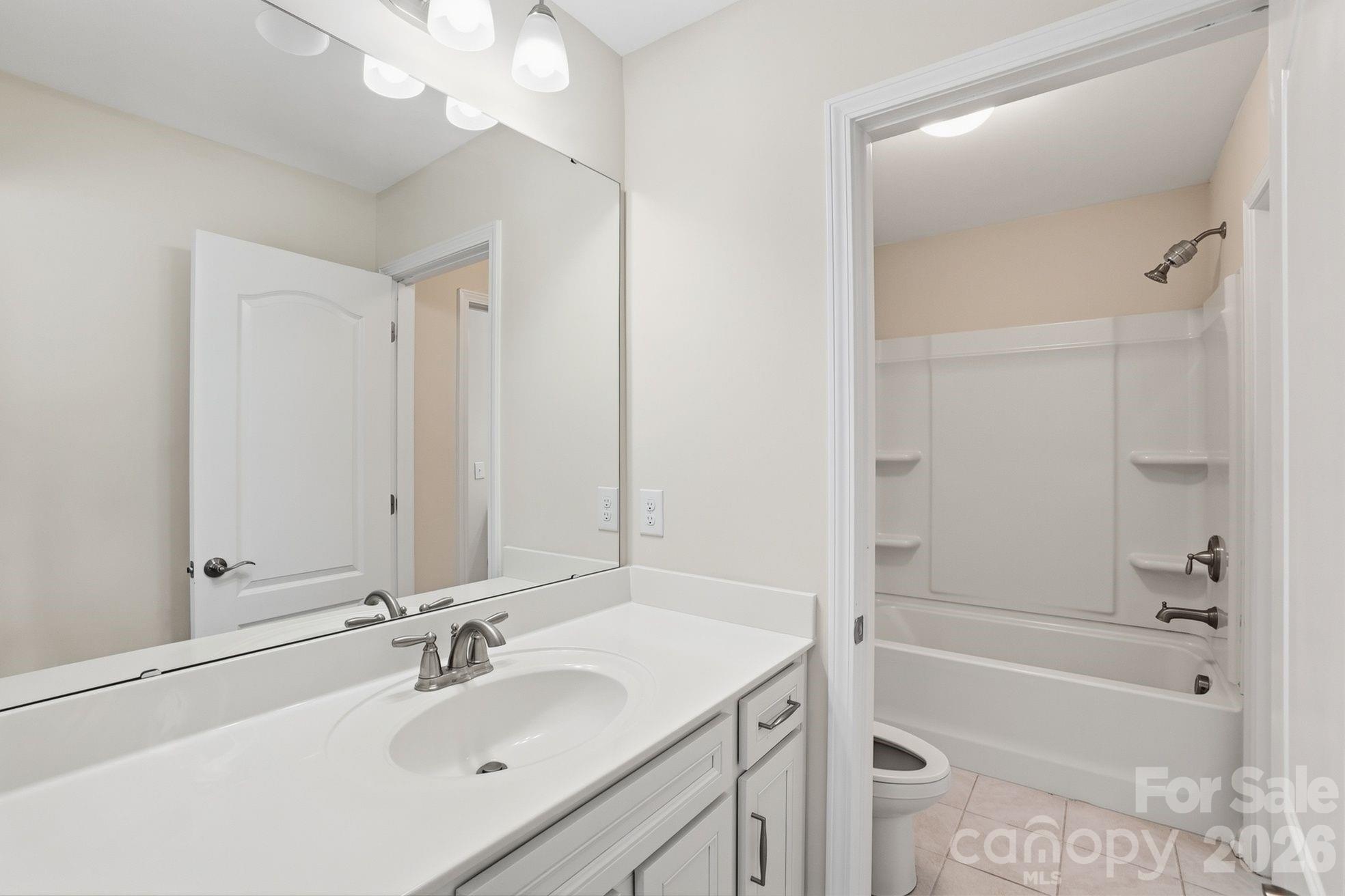 4029 Spring Garden Street Fort Mill, SC 29715 - Photo 33 of 48 a bathroom with a tub sink vanity and a mirror