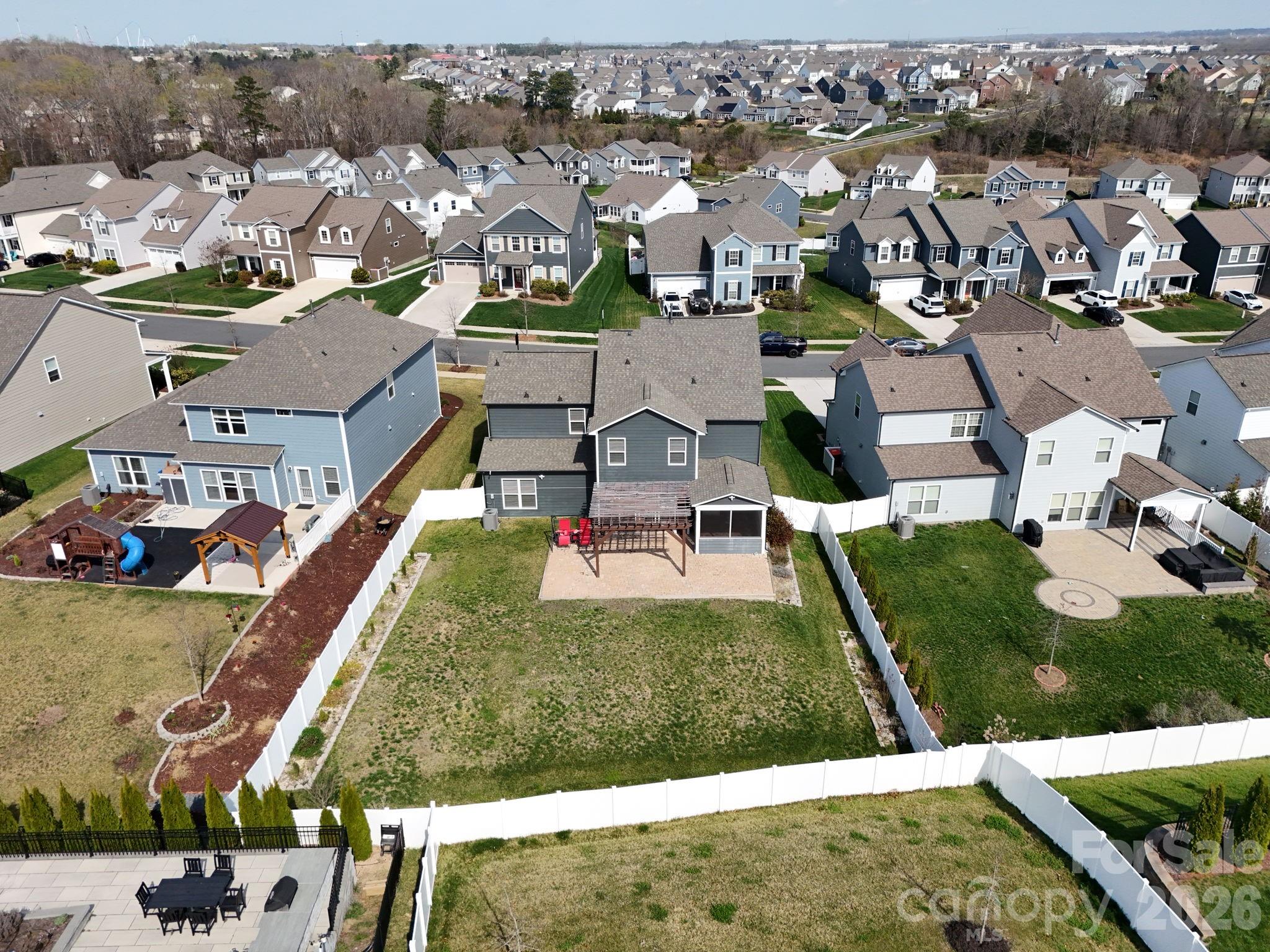 4029 Spring Garden Street Fort Mill, SC 29715 - Photo 37 of 48 an aerial view of residential houses with outdoor space and swimming pool