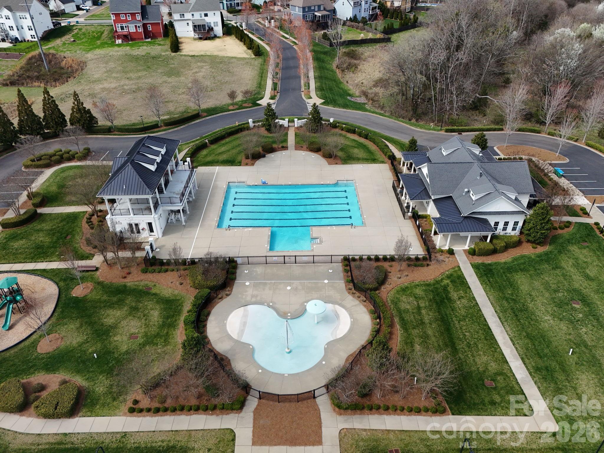 4029 Spring Garden Street Fort Mill, SC 29715 - Photo 41 of 48 an aerial view of a house with swimming pool and a yard