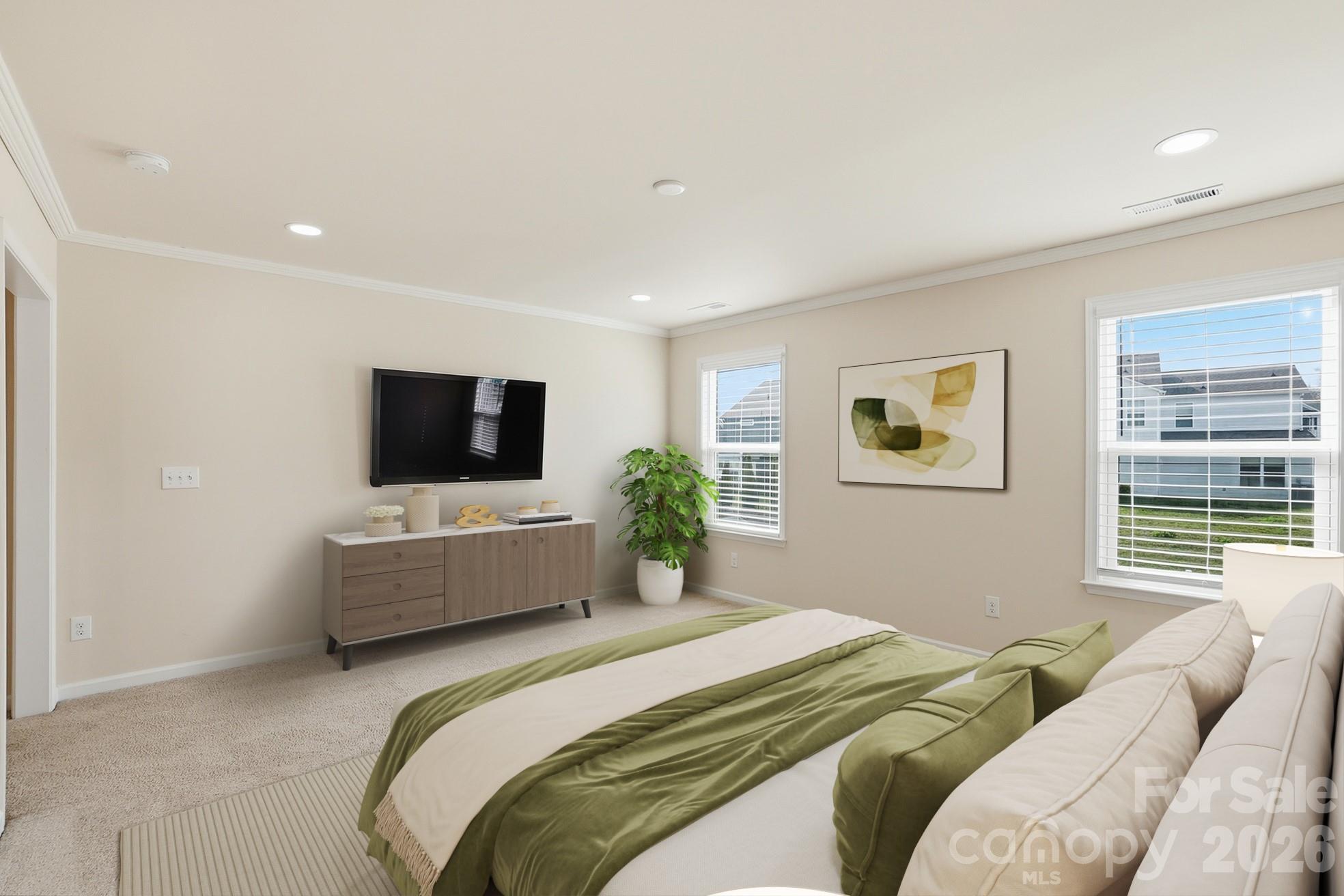 4029 Spring Garden Street Fort Mill, SC 29715 - Photo 5 of 48 a bedroom with a bed and a flat screen tv