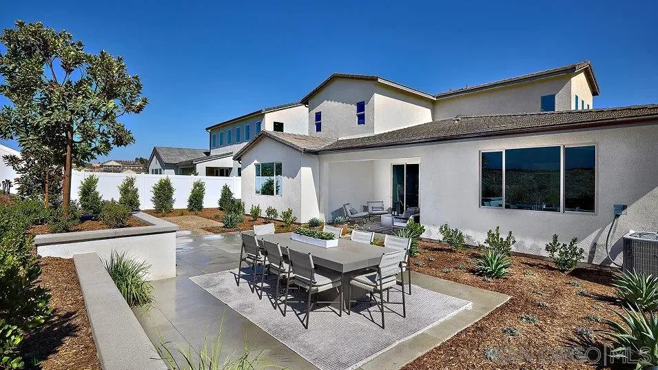 5556 Alethea Way Oceanside, CA 92057 - Photo 18 of 26 a view of a patio with couches table and chairs and potted plants