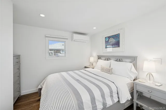 a bedroom with bed and a window