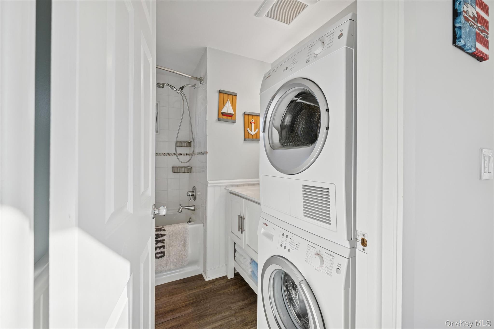 100 Deforest Road, Unit 25 Montauk, NY 11954 - Photo 10 of 21 a view of a storage and utility room with washer and dryer