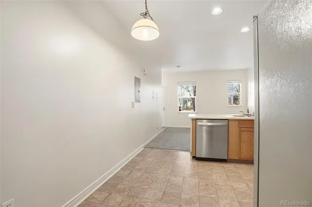 a view of a kitchen with a sink and dishwasher kitchen view