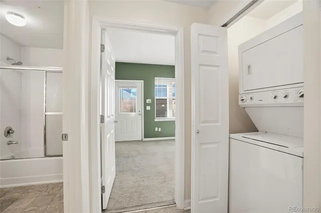 a view of bathroom with a washer and dryer