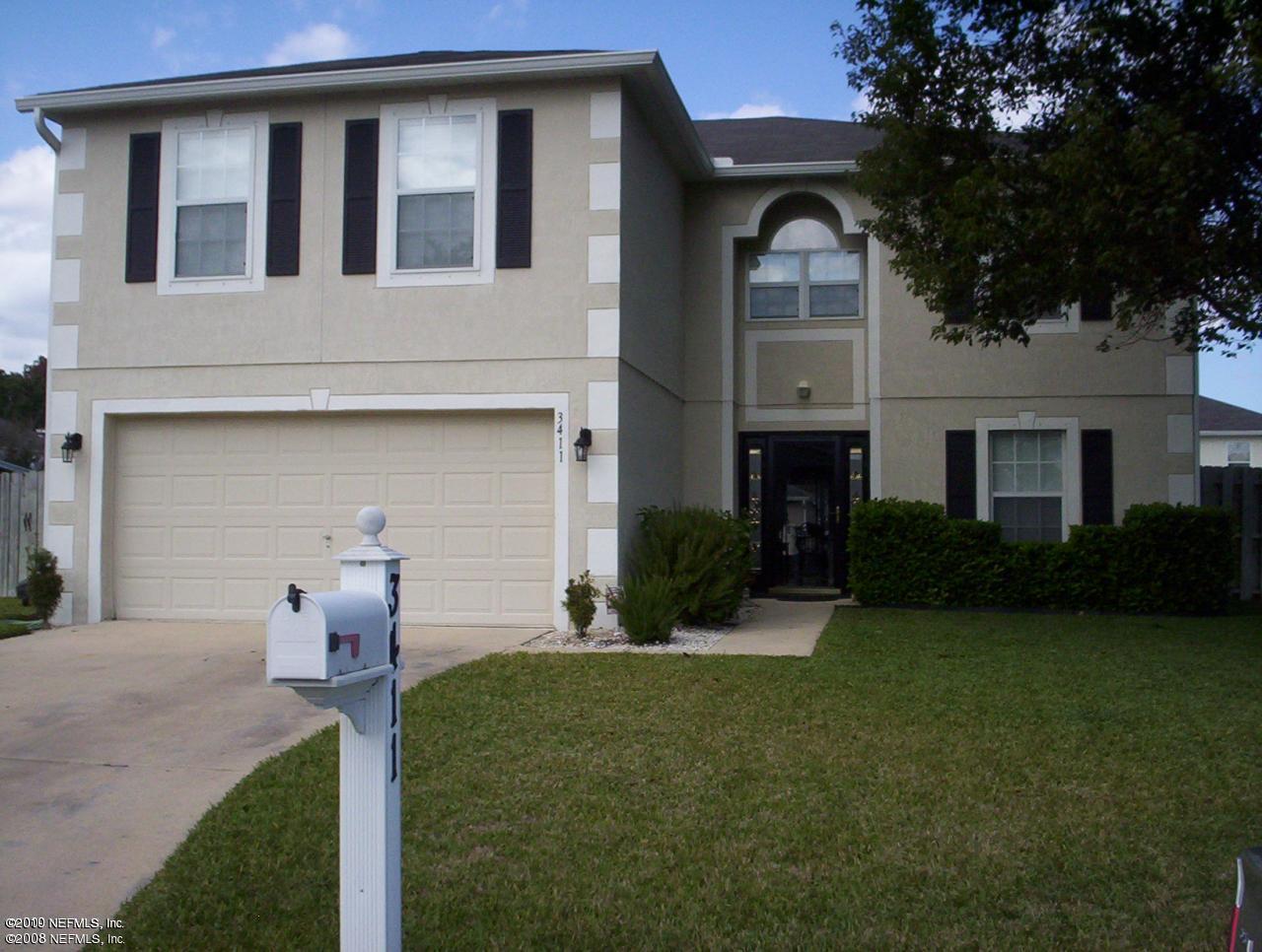 3411 Hickory Hammock Road Jacksonville, FL 32226 - Photo 1 of 14 a front view of a house with a yard and garage