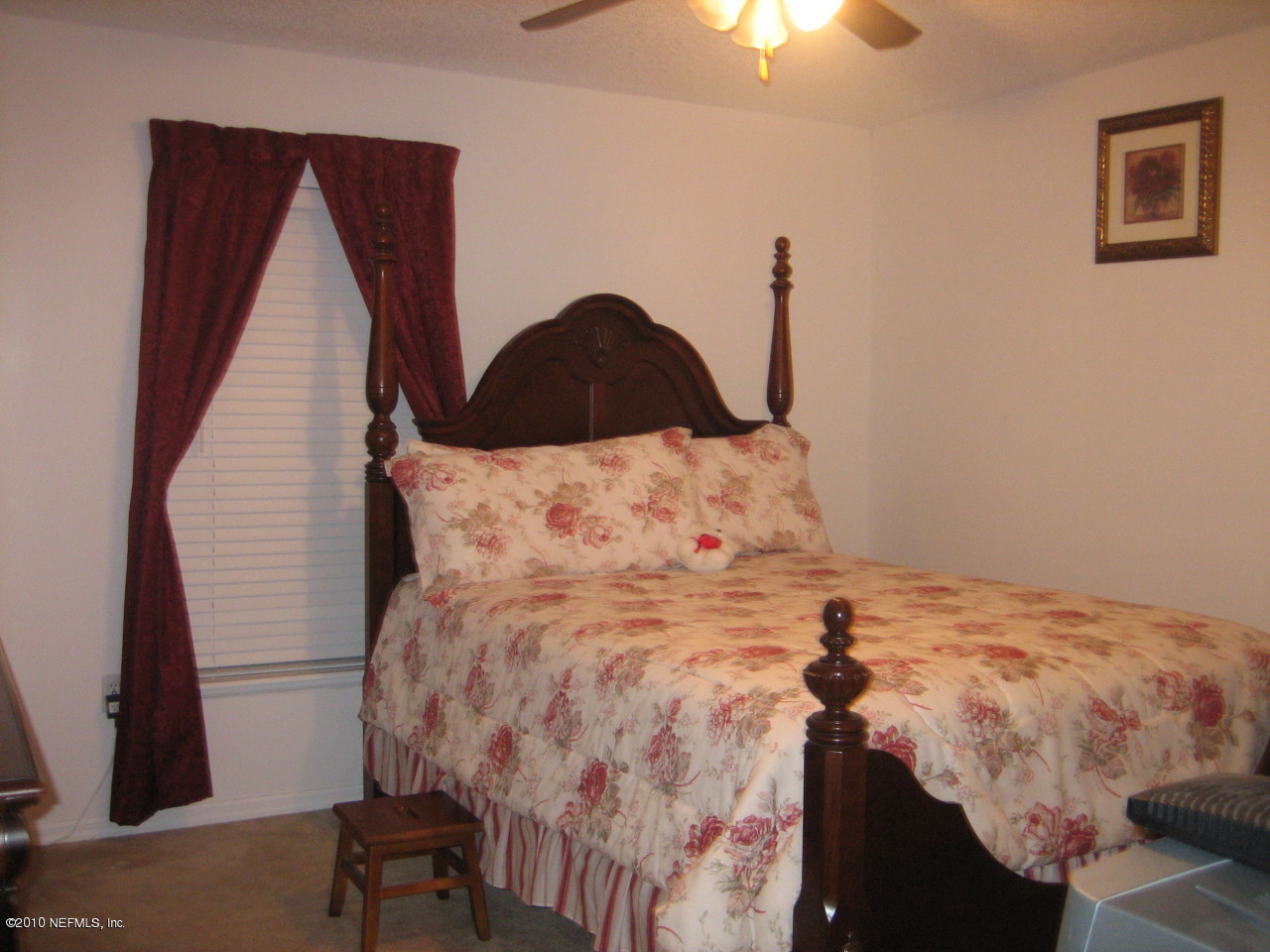 3411 Hickory Hammock Road Jacksonville, FL 32226 - Photo 14 of 14 a bedroom with a bed and a chandelier